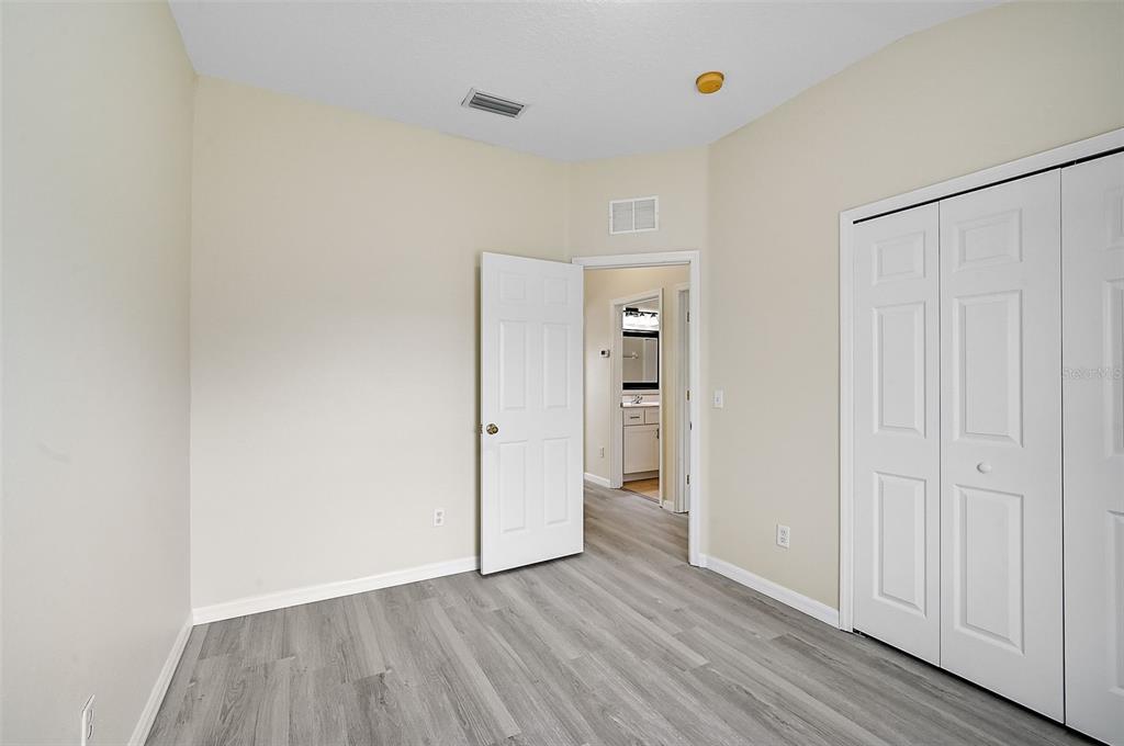 14939 Amberjack Terrace, Unit 102 Lakewood Ranch, FL 34202 - Photo 27 of 34 a view of an empty room with wooden floor