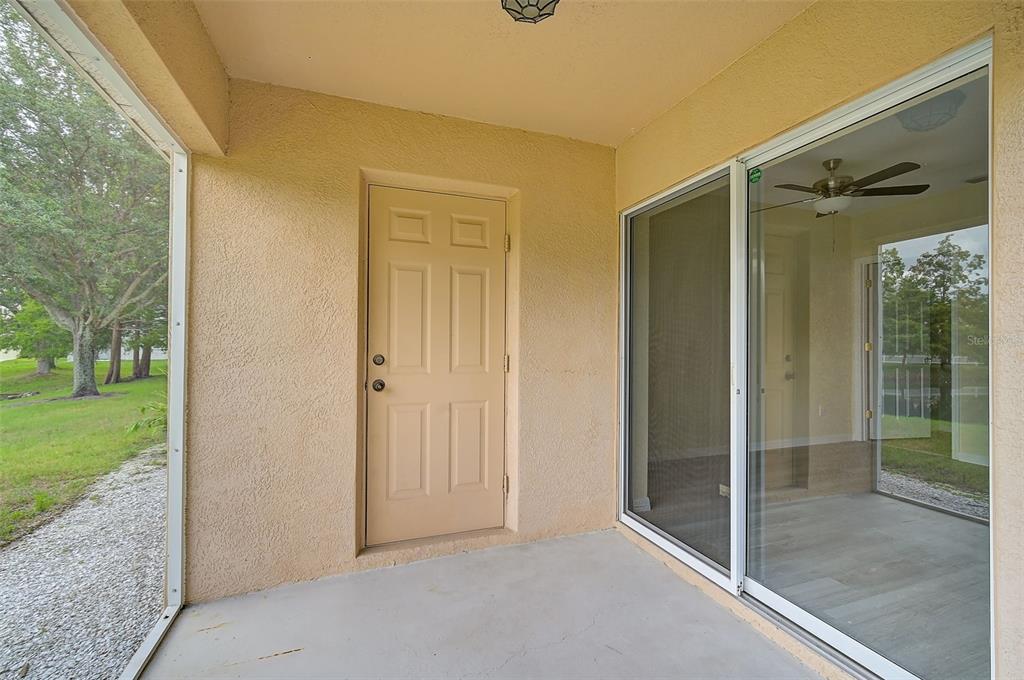 14939 Amberjack Terrace, Unit 102 Lakewood Ranch, FL 34202 - Photo 31 of 34 a view of a glass door and a yard