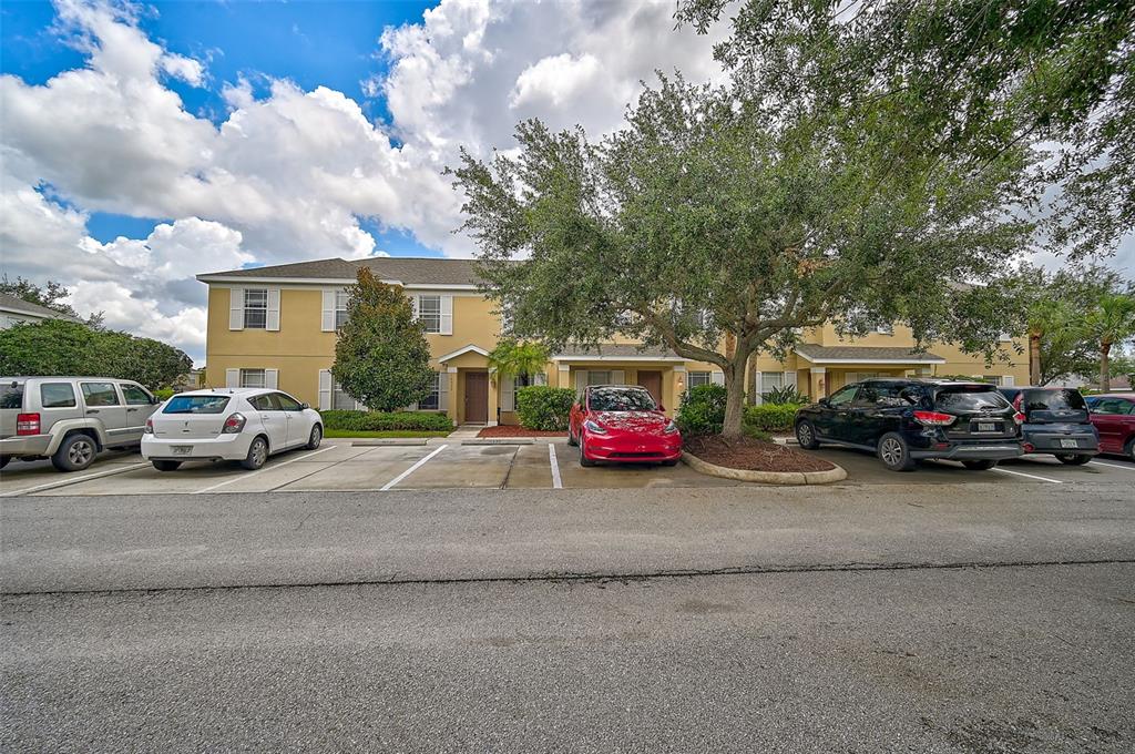 14939 Amberjack Terrace, Unit 102 Lakewood Ranch, FL 34202 - Photo 33 of 34 a view of a cars parked in front of a house