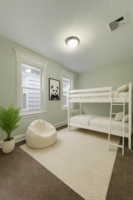 801 John F. Kennedy Boulevard, Unit 2 Bayonne, NJ 07002 - Photo 3 of 8 a bedroom with a bed and a potted plant