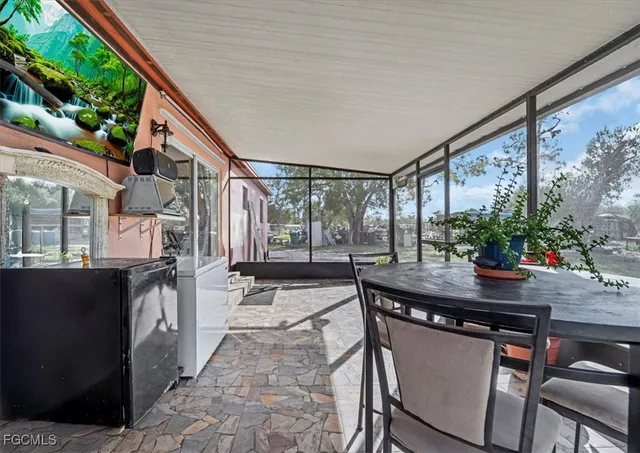 a patio with table and chairs
