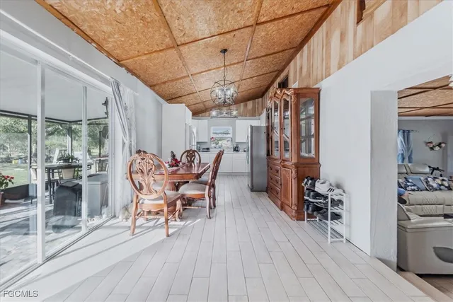 a dining room with furniture and wooden floor