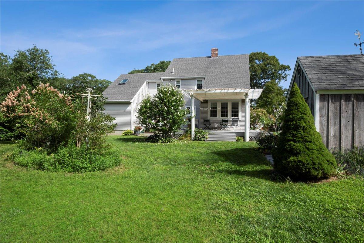 2 Crowell Road Sandwich, MA 02563 - Photo 15 of 34 a front view of a house with garden