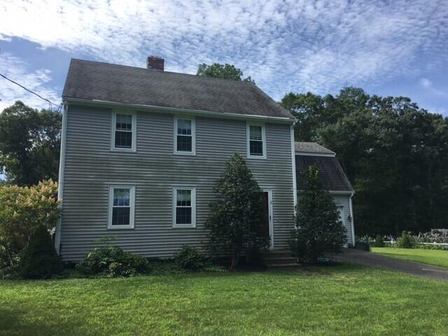 2 Crowell Road Sandwich, MA 02563 - Photo 2 of 34 a front view of a house with a garden