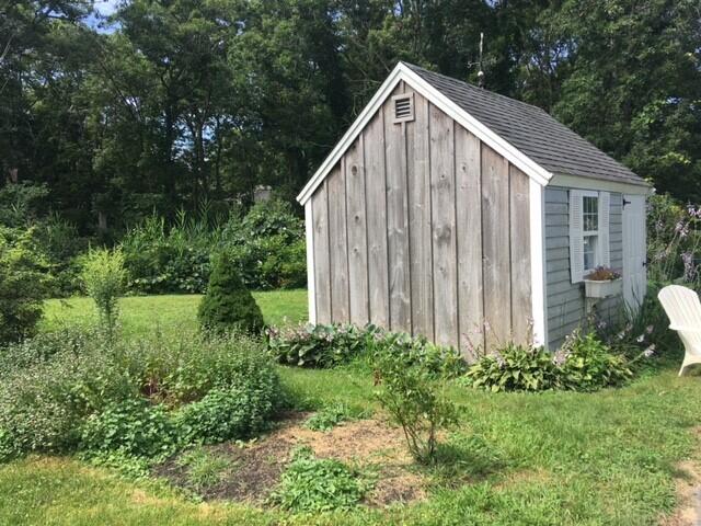 2 Crowell Road Sandwich, MA 02563 - Photo 21 of 34 a view of a house with backyard and garden