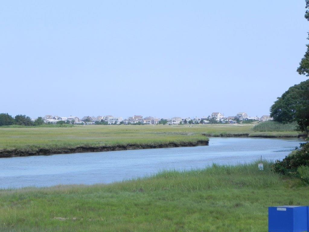 2 Crowell Road Sandwich, MA 02563 - Photo 26 of 34 a view of a lake with houses in the background