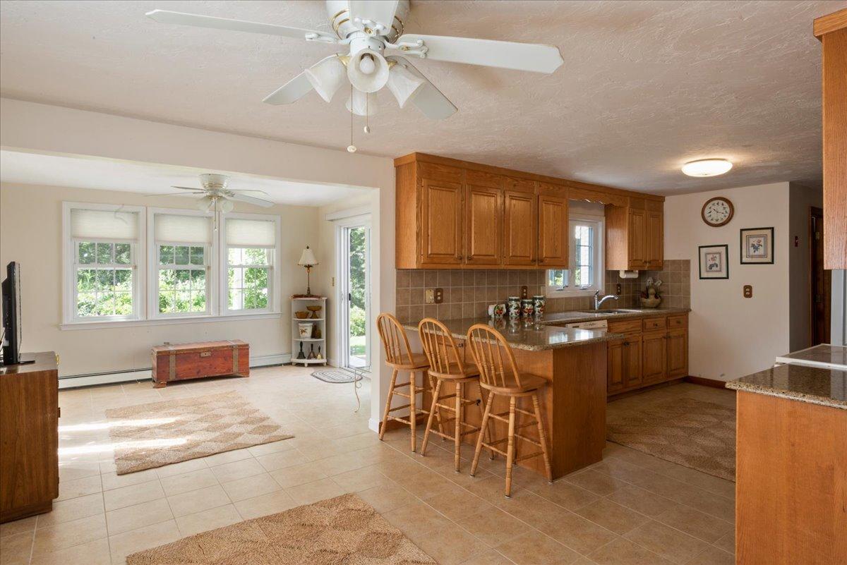 2 Crowell Road Sandwich, MA 02563 - Photo 8 of 34 a kitchen with a window and stainless steel appliances