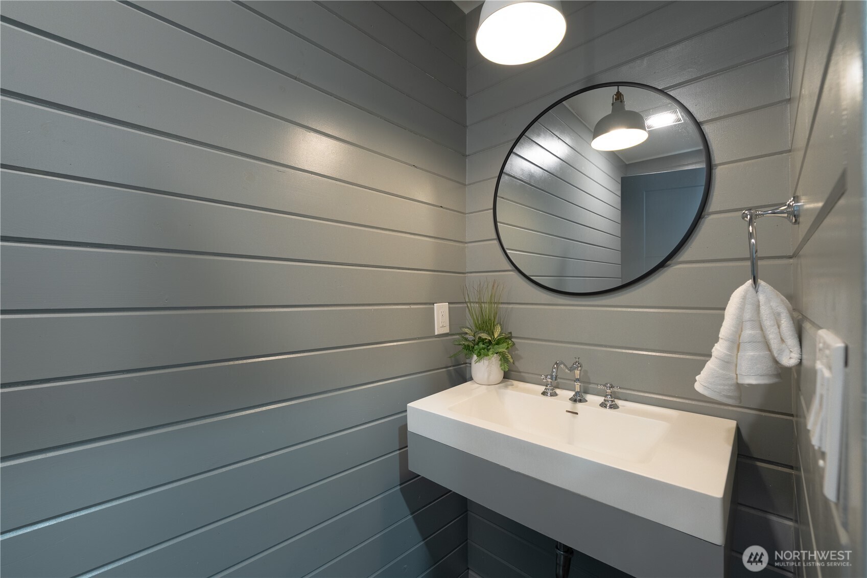 4418 40th Avenue Southwest Seattle, WA 98116 - Photo 14 of 40 a bathroom with a sink and mirror