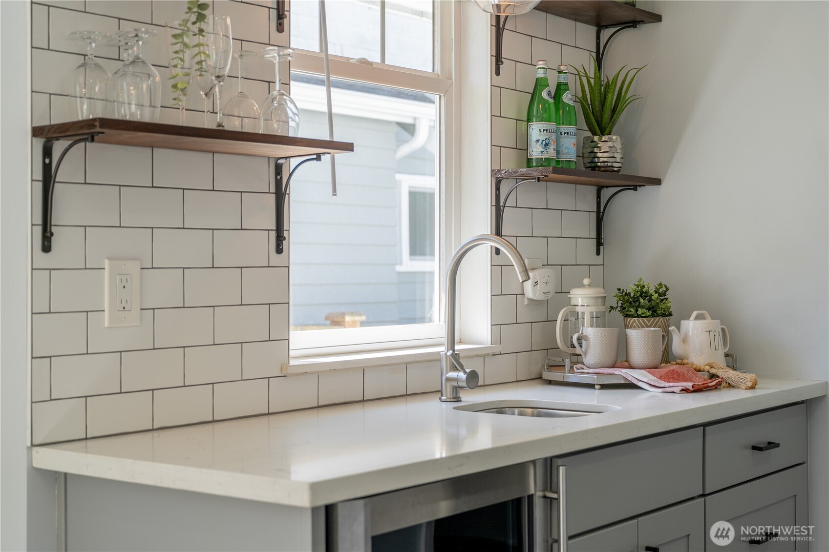 4418 40th Avenue Southwest Seattle, WA 98116 - Photo 17 of 40 a kitchen with a sink and a window