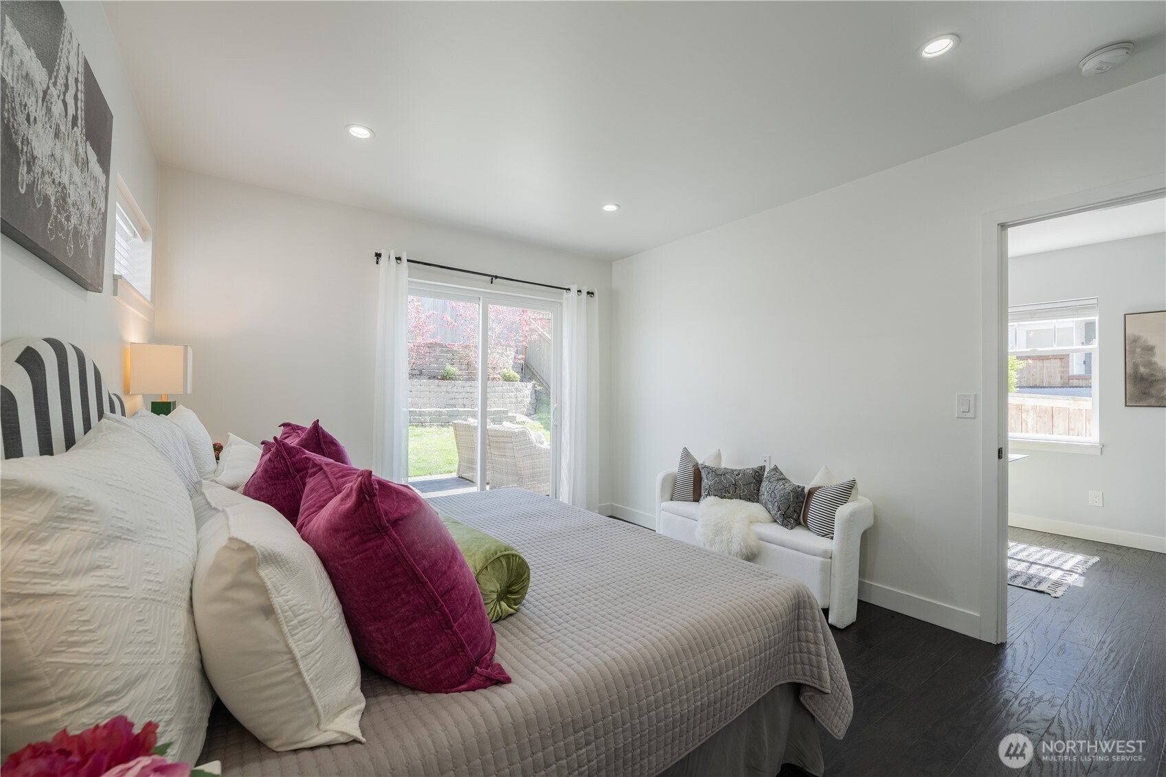 4418 40th Avenue Southwest Seattle, WA 98116 - Photo 22 of 40 a bed sitting in a bedroom next to a window