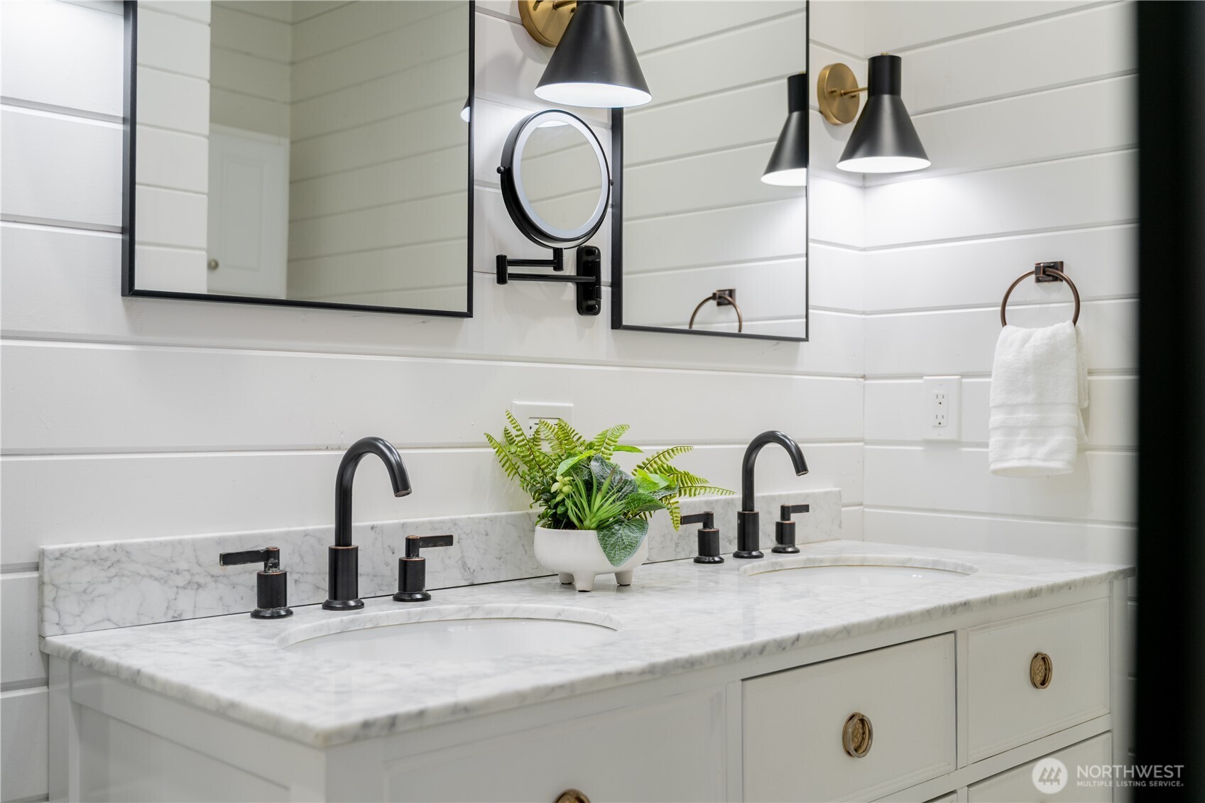 4418 40th Avenue Southwest Seattle, WA 98116 - Photo 24 of 40 a bathroom with a sink and a mirror
