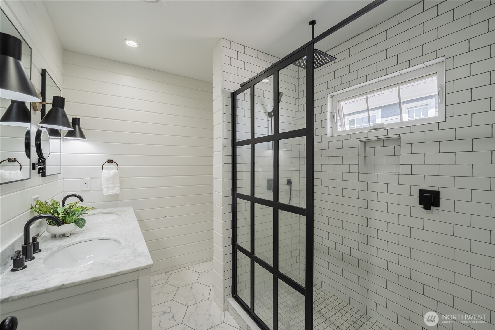 4418 40th Avenue Southwest Seattle, WA 98116 - Photo 25 of 40 a bathroom with a sink a mirror and shower