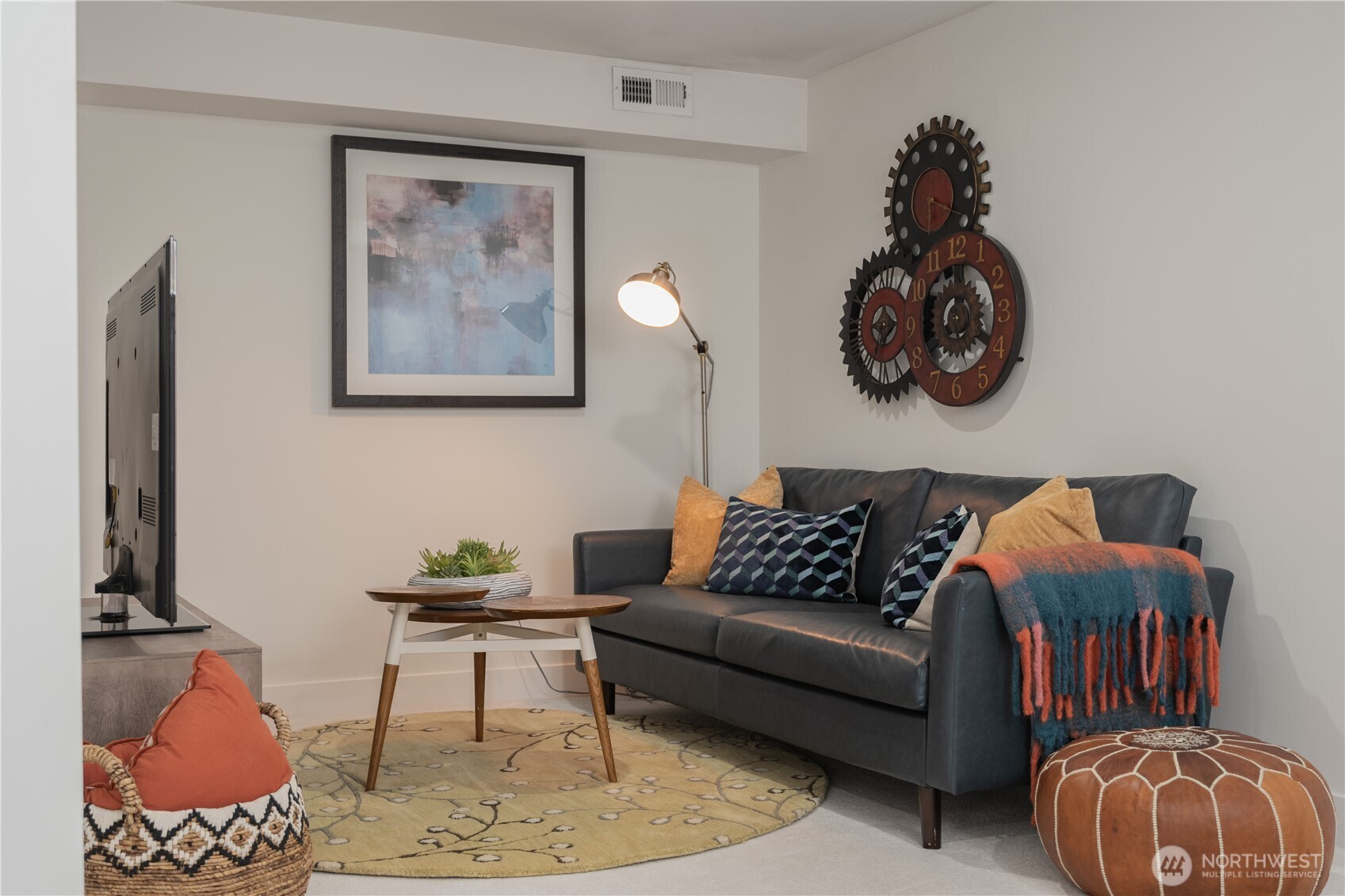 4418 40th Avenue Southwest Seattle, WA 98116 - Photo 28 of 40 a living room with furniture and wall paintings