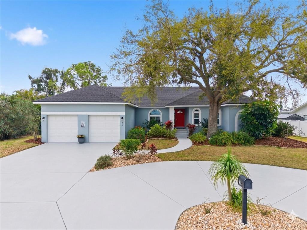 846 Birdie Way Apollo Beach, FL 33572 - Photo 1 of 31 a front view of a house with a yard and garage
