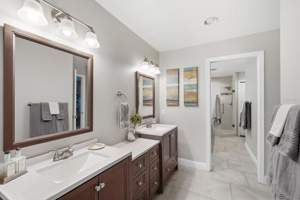 846 Birdie Way Apollo Beach, FL 33572 - Photo 15 of 31 a spacious bathroom with a double vanity sink mirror and double