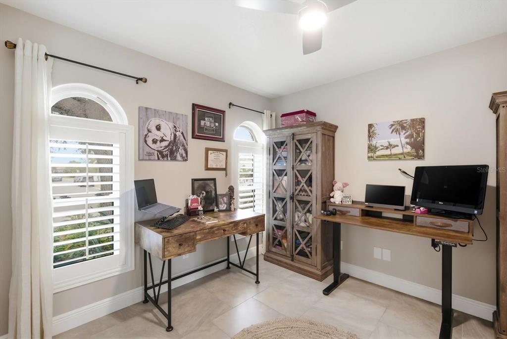 846 Birdie Way Apollo Beach, FL 33572 - Photo 19 of 31 a view of a workspace with furniture and a window