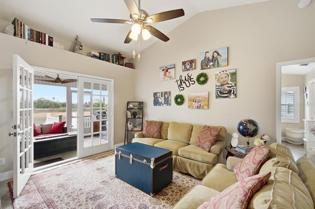 846 Birdie Way Apollo Beach, FL 33572 - Photo 22 of 31 a living room with furniture and a large window