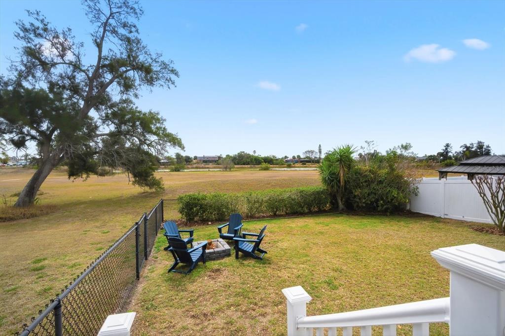 846 Birdie Way Apollo Beach, FL 33572 - Photo 5 of 31 a view of a lake with couches chairs
