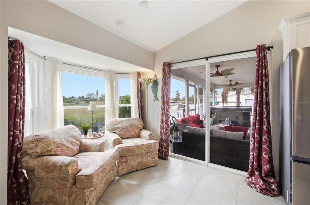 846 Birdie Way Apollo Beach, FL 33572 - Photo 10 of 31 a living room with furniture and a large window