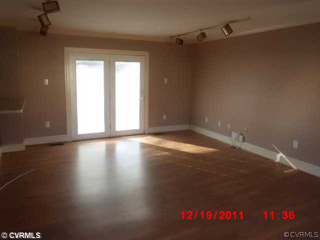 2913 Sherbourne Road Richmond, VA 23237 - Photo 3 of 12 a view of a livingroom with wooden floor and a window