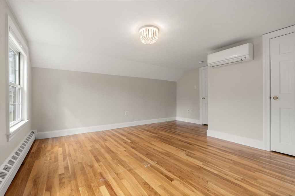 92 Abbot Street Andover, MA 01810 - Photo 29 of 35 an empty room with wooden floor and windows