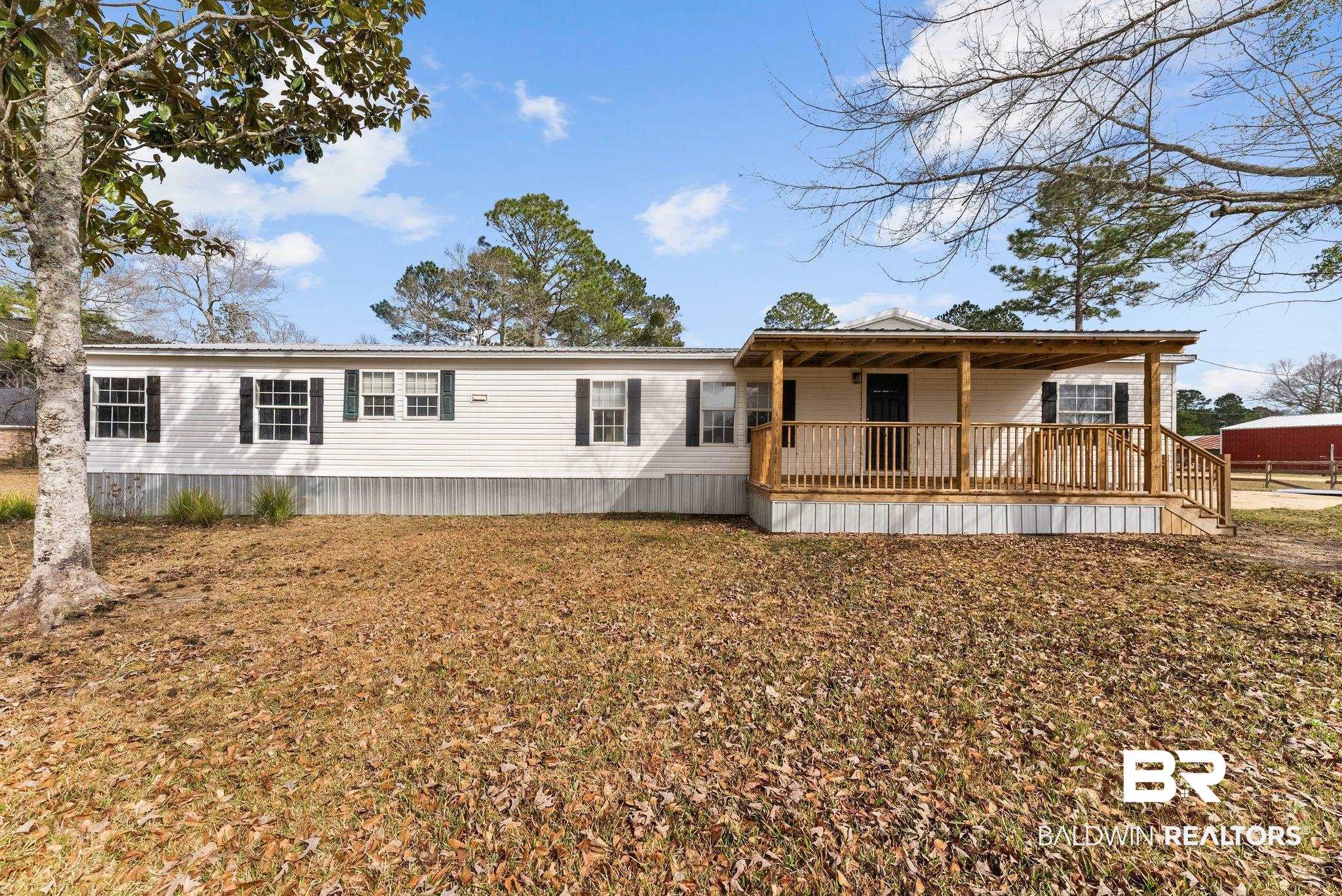 34904 Pine Road South Stapleton, AL 36578 - Photo 1 of 42 Manufactured / mobile home with a front yard and a porch
