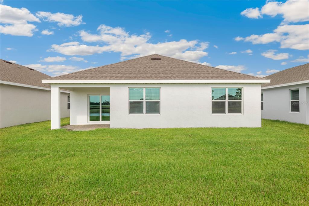 9489 Turtle Grass Circle Punta Gorda, FL 33950 - Photo 16 of 19 a view of a house with a backyard