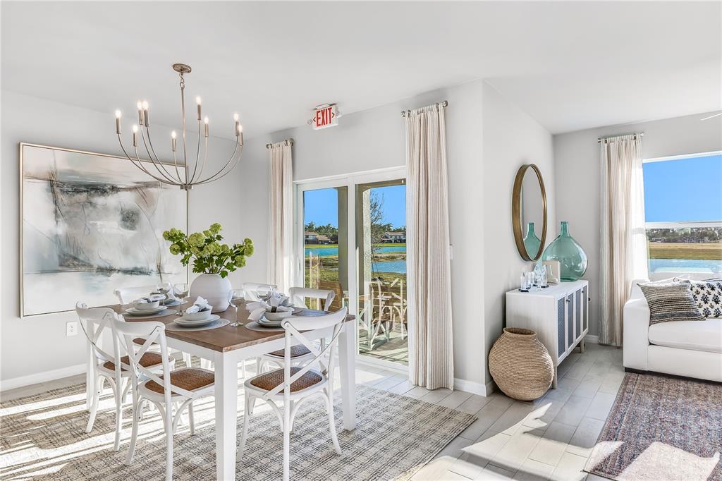 9489 Turtle Grass Circle Punta Gorda, FL 33950 - Photo 5 of 19 a view of a dining room with furniture window and wooden floor