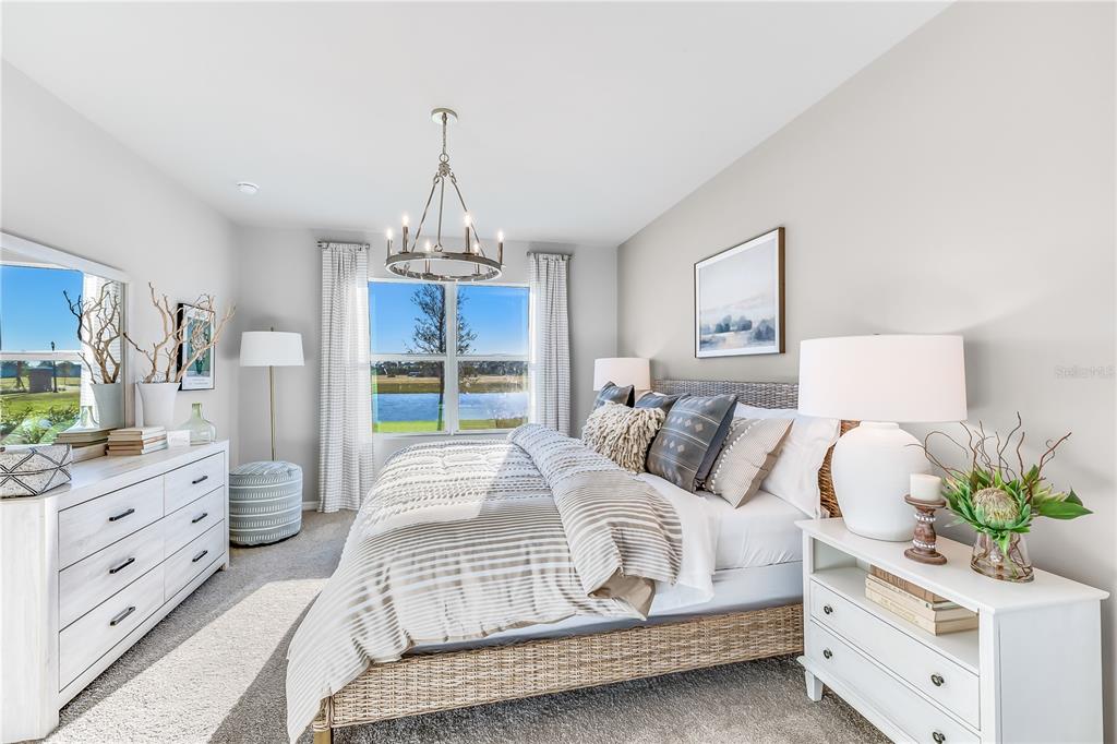 9489 Turtle Grass Circle Punta Gorda, FL 33950 - Photo 10 of 19 a spacious bedroom with a bed and a window in it