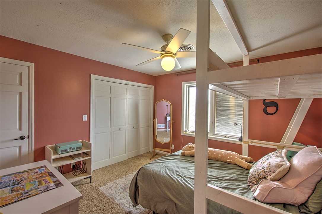 4670 Trevino Lane Decatur, IL 62526 - Photo 24 of 39 a bed room with a bed and a mirror