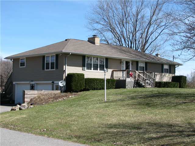 3263 Rose Road Batavia, NY 14020 - Photo 1 of 1 Exterior Front Spacious hillside ranch complete wi