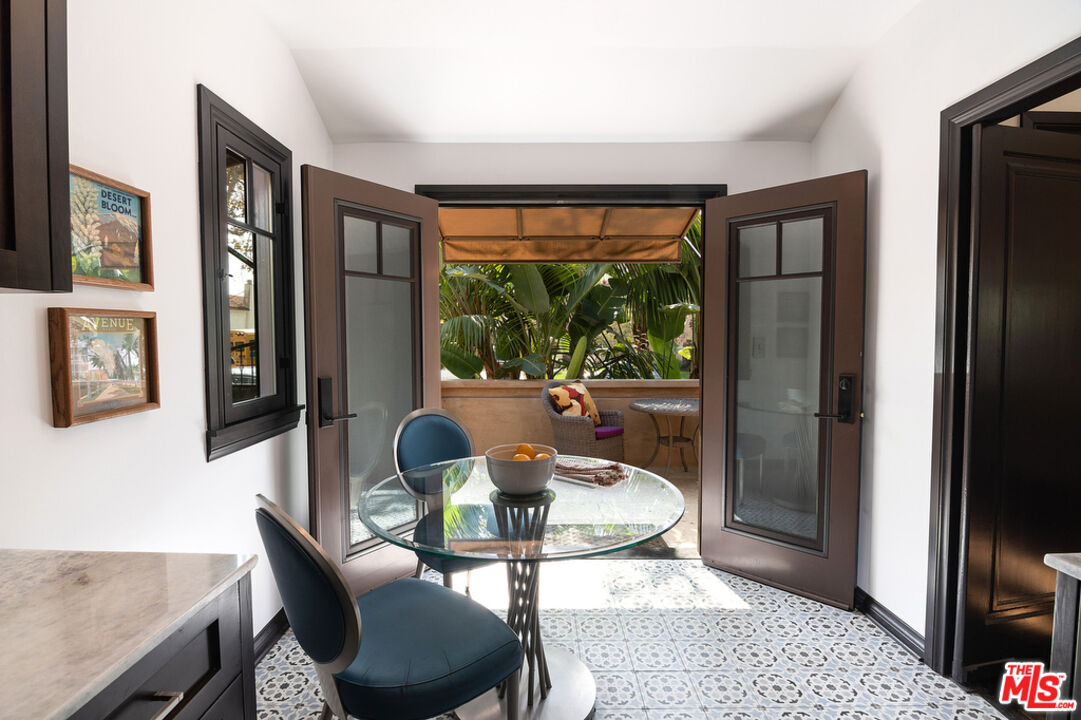 6331 Drexel Avenue Los Angeles, CA 90048 - Photo 17 of 37 a dining room with furniture and a floor to ceiling window