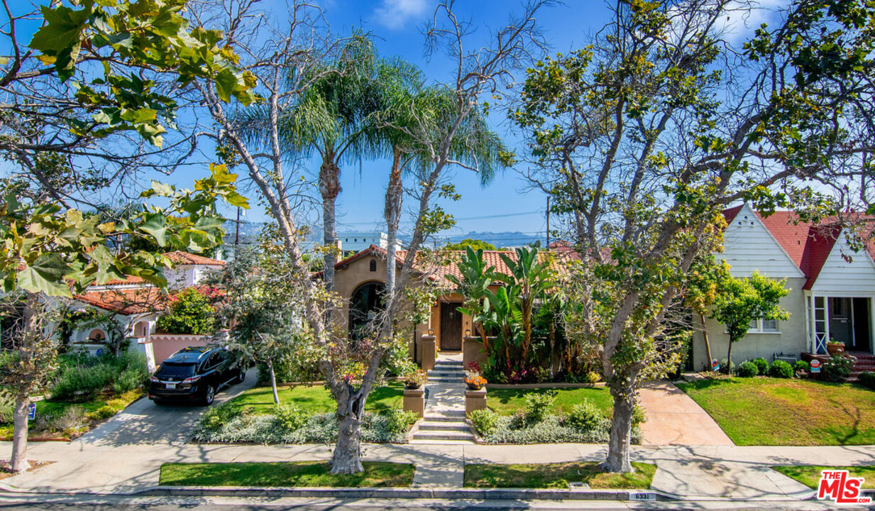 6331 Drexel Avenue Los Angeles, CA 90048 - Photo 2 of 37 a front view of a house with garden