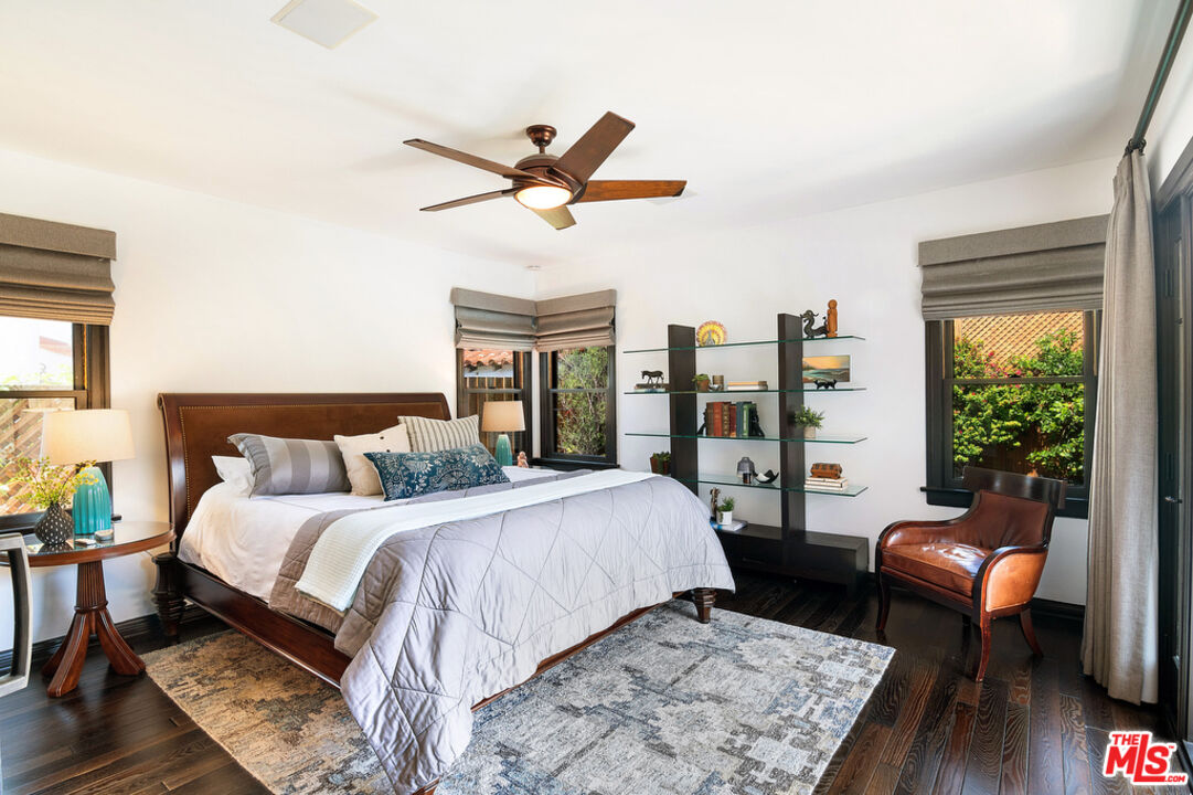 6331 Drexel Avenue Los Angeles, CA 90048 - Photo 27 of 37 a bedroom with a bed a couch and a potted plant on the dresser
