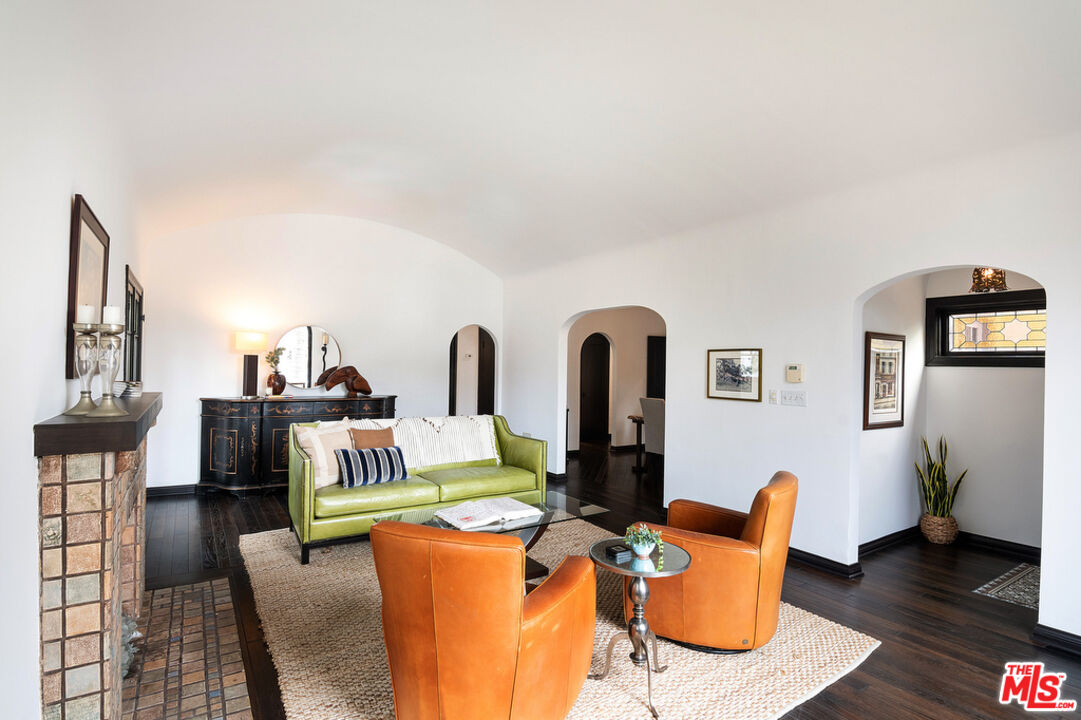 6331 Drexel Avenue Los Angeles, CA 90048 - Photo 7 of 37 a living room with furniture a table and wooden floor