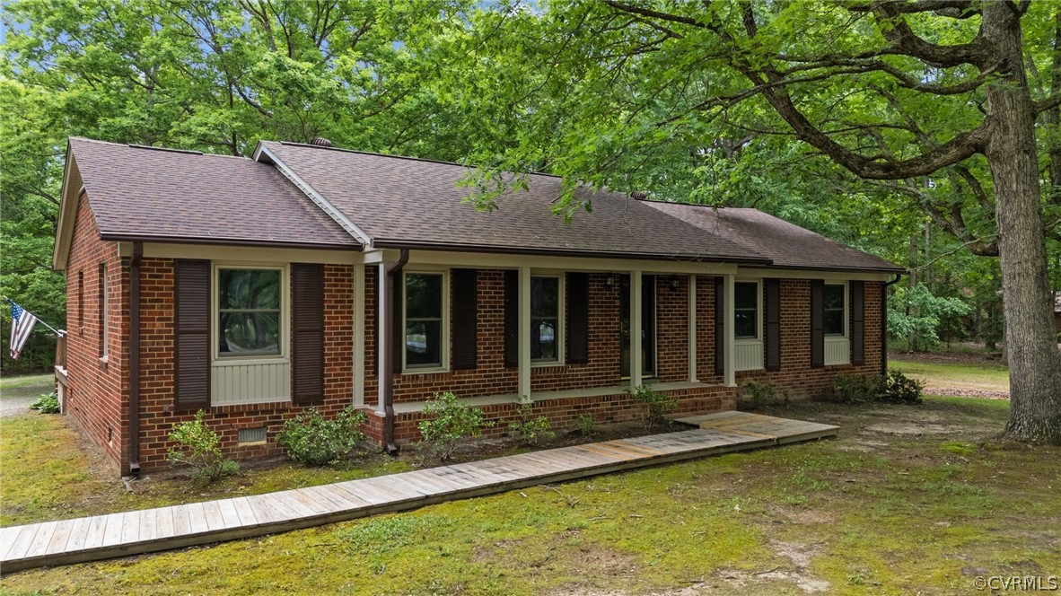 a front view of a house with a yard table and chairs