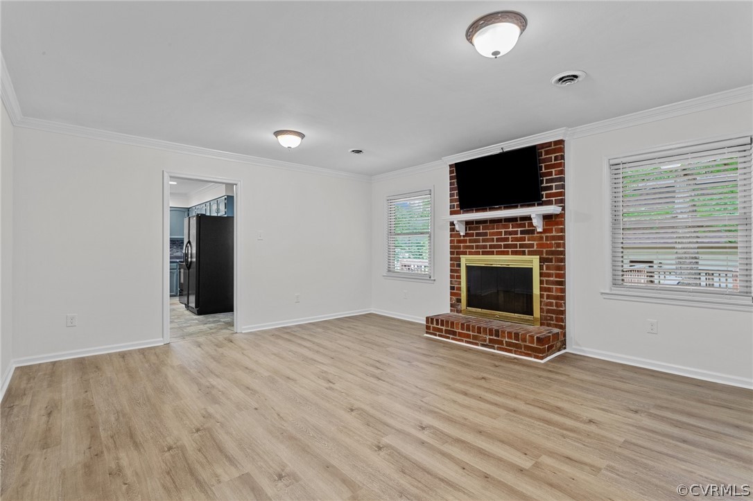 8601 Beaver Bridge Road Moseley, VA 23120 - Photo 11 of 42 a view of a livingroom with a fireplace and window