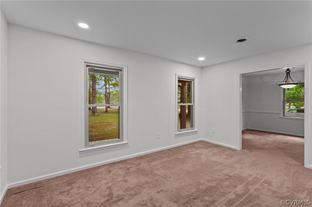 8601 Beaver Bridge Road Moseley, VA 23120 - Photo 13 of 42 an empty room with windows and closet