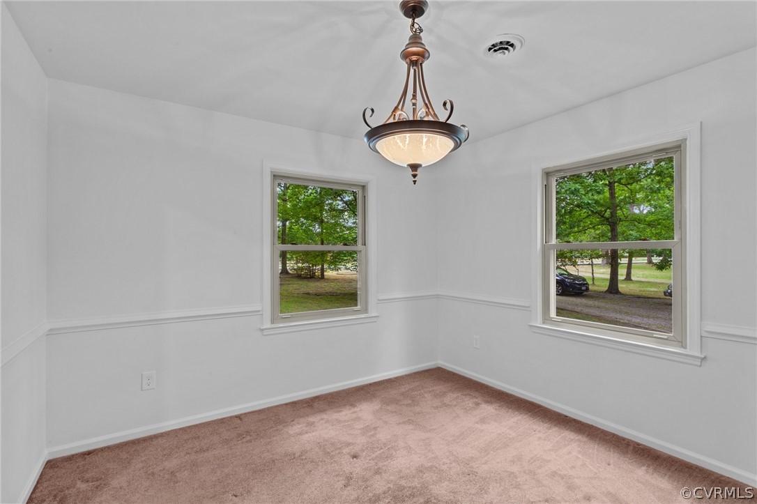 8601 Beaver Bridge Road Moseley, VA 23120 - Photo 15 of 42 a view of empty room with window and chandelier