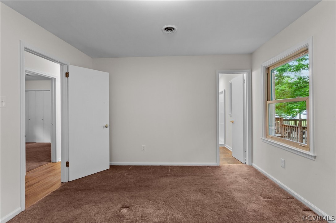 8601 Beaver Bridge Road Moseley, VA 23120 - Photo 17 of 42 a view of an empty room with a window