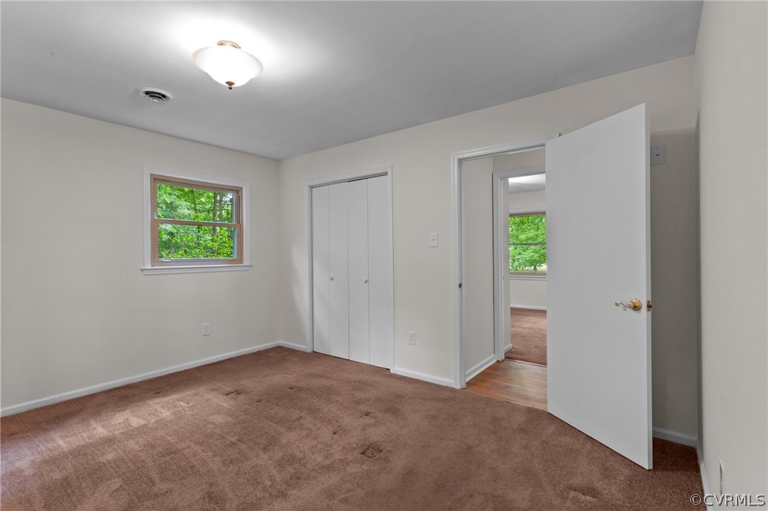 8601 Beaver Bridge Road Moseley, VA 23120 - Photo 18 of 42 an empty room with windows and closet