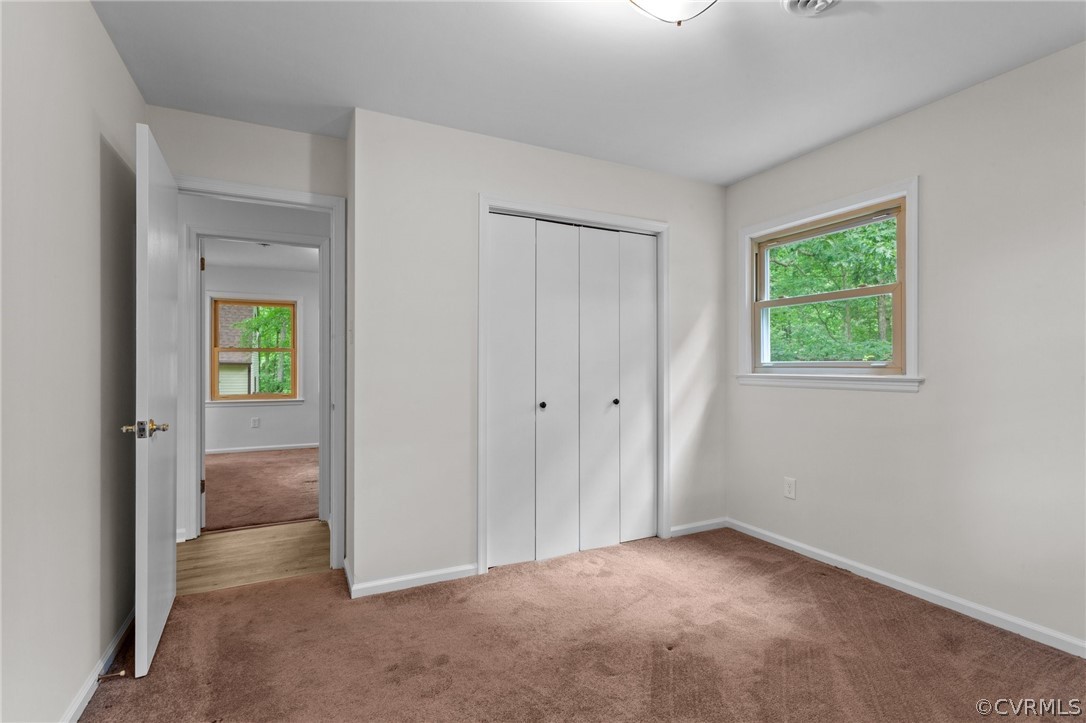 8601 Beaver Bridge Road Moseley, VA 23120 - Photo 21 of 42 an empty room with windows and closet