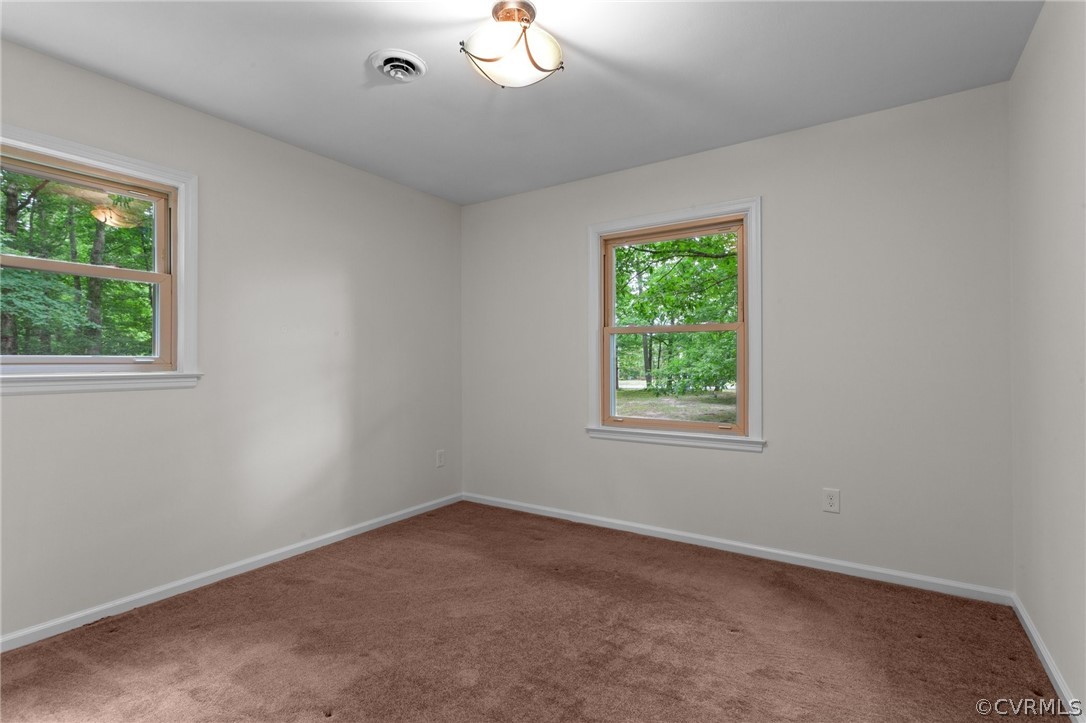 8601 Beaver Bridge Road Moseley, VA 23120 - Photo 22 of 42 an empty room with a window