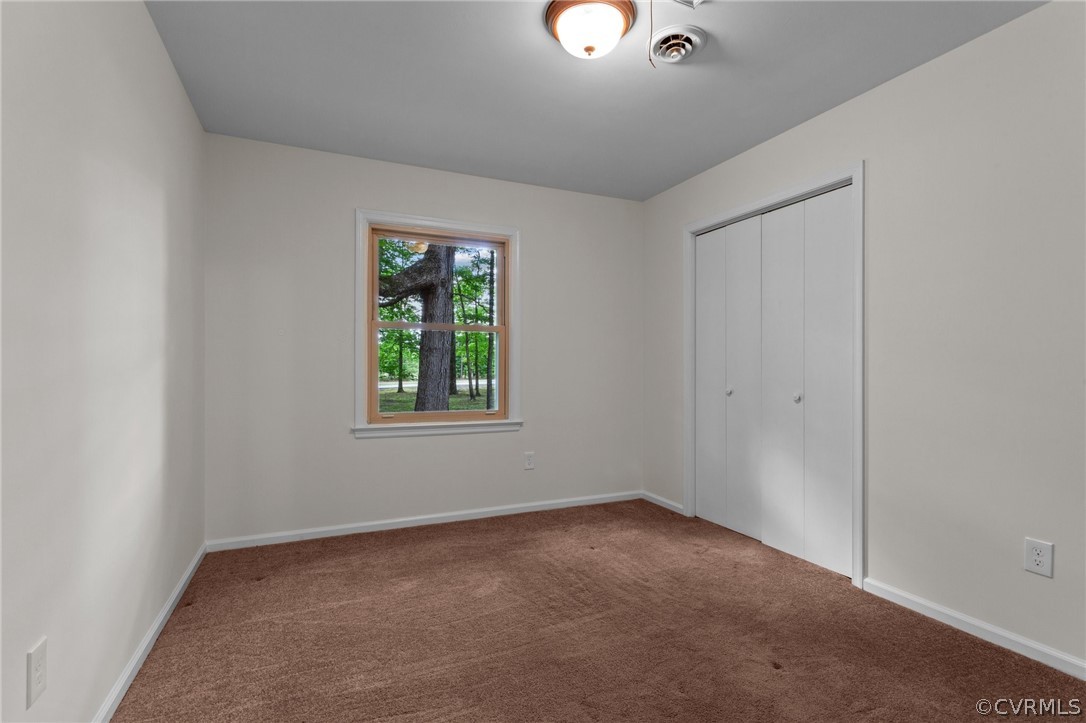 8601 Beaver Bridge Road Moseley, VA 23120 - Photo 23 of 42 an empty room with windows