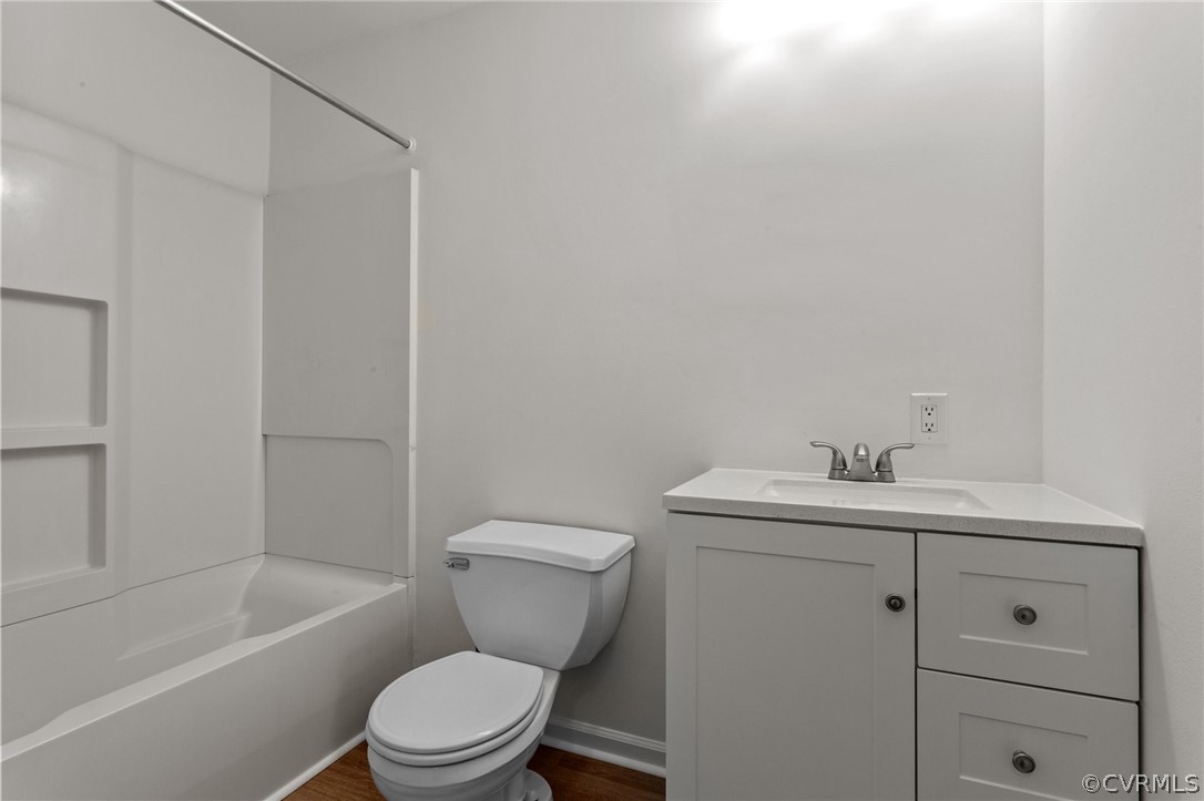 8601 Beaver Bridge Road Moseley, VA 23120 - Photo 25 of 42 a bathroom with a toilet a sink and bathtub