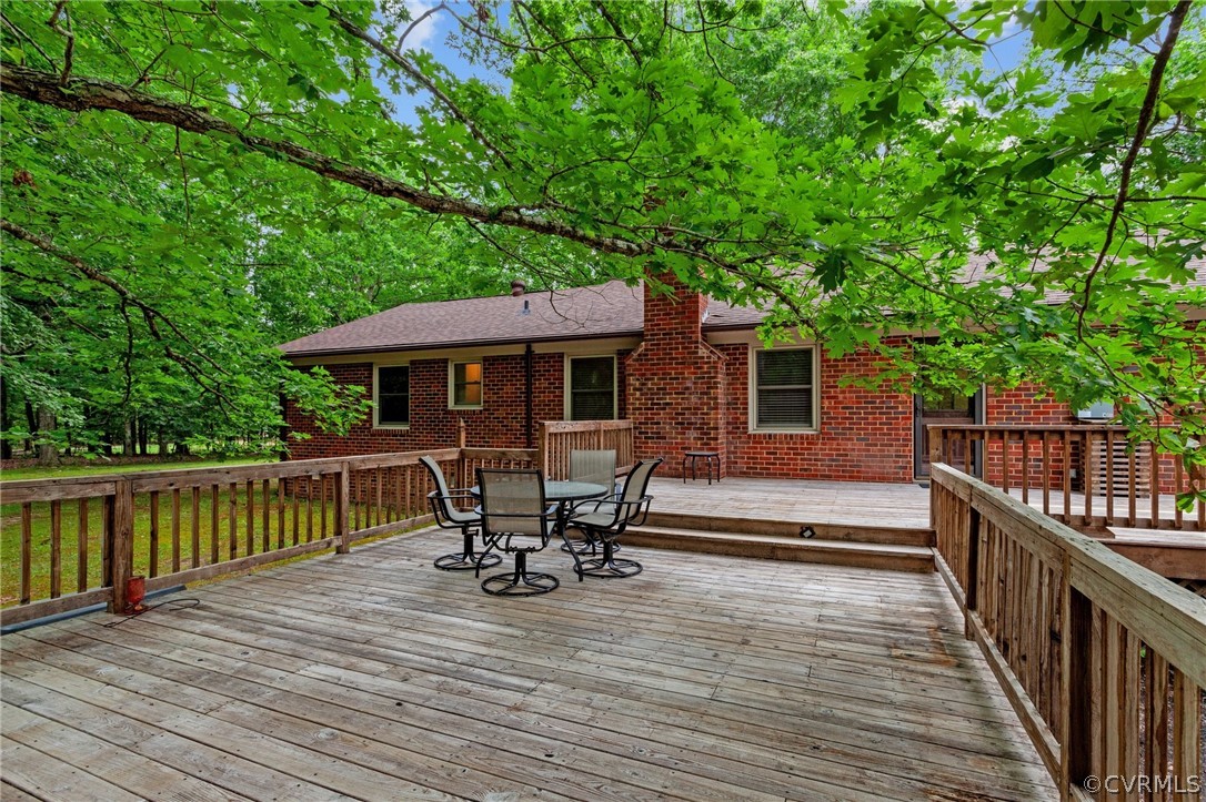 8601 Beaver Bridge Road Moseley, VA 23120 - Photo 30 of 42 a view of a wooden deck with furniture