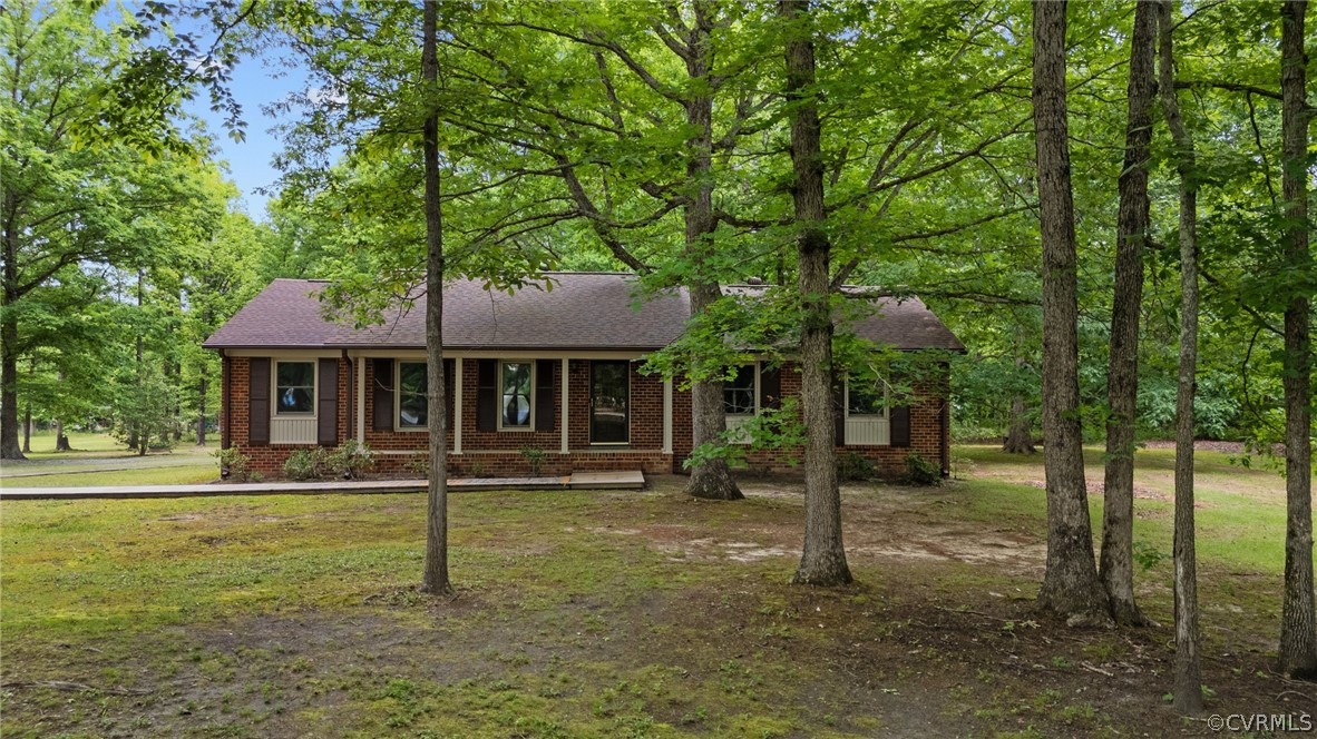 8601 Beaver Bridge Road Moseley, VA 23120 - Photo 35 of 42 a front view of a house with a yard