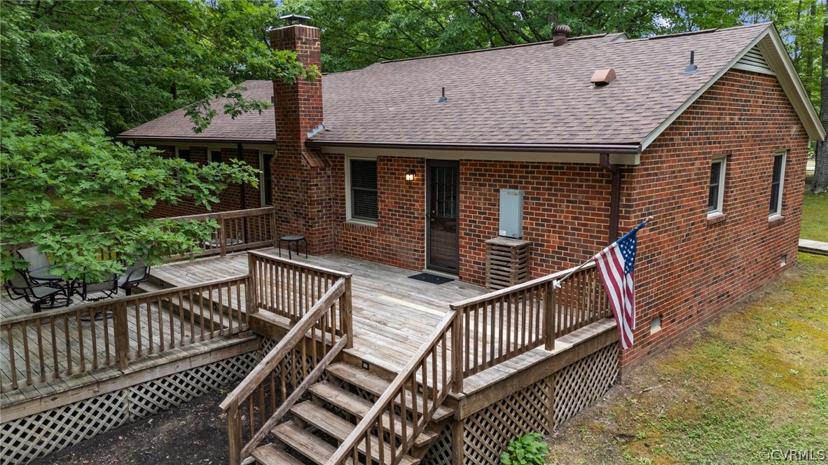 8601 Beaver Bridge Road Moseley, VA 23120 - Photo 4 of 42 a view of house with wooden deck and furniture