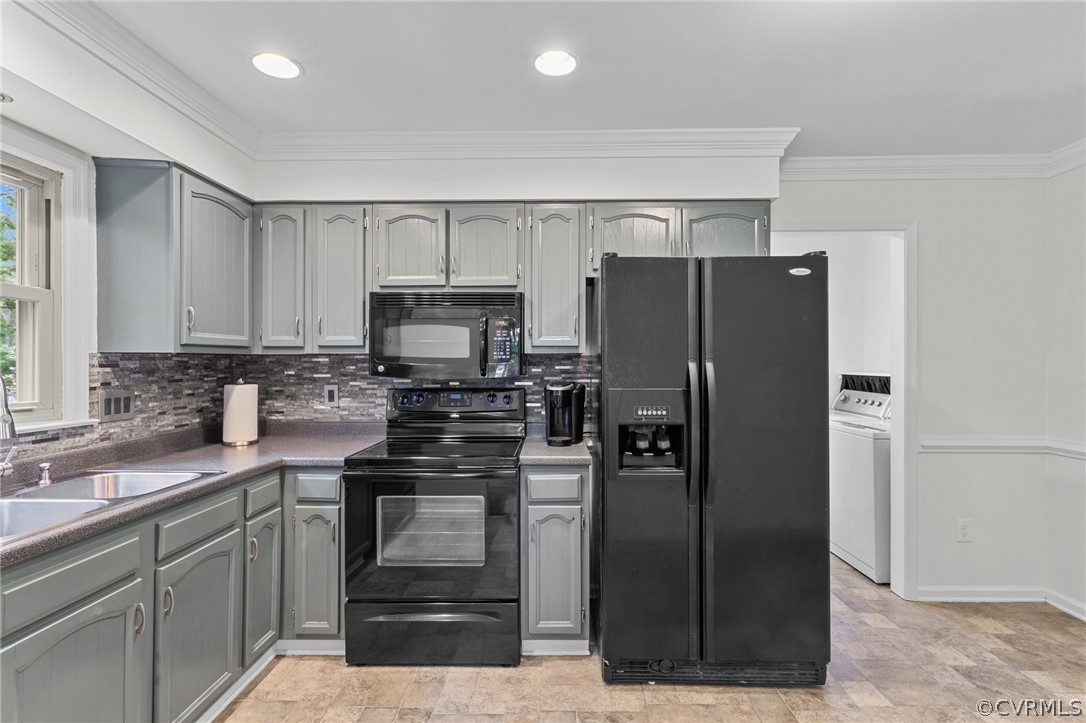 8601 Beaver Bridge Road Moseley, VA 23120 - Photo 8 of 42 a kitchen with a refrigerator sink and stainless steel appliances