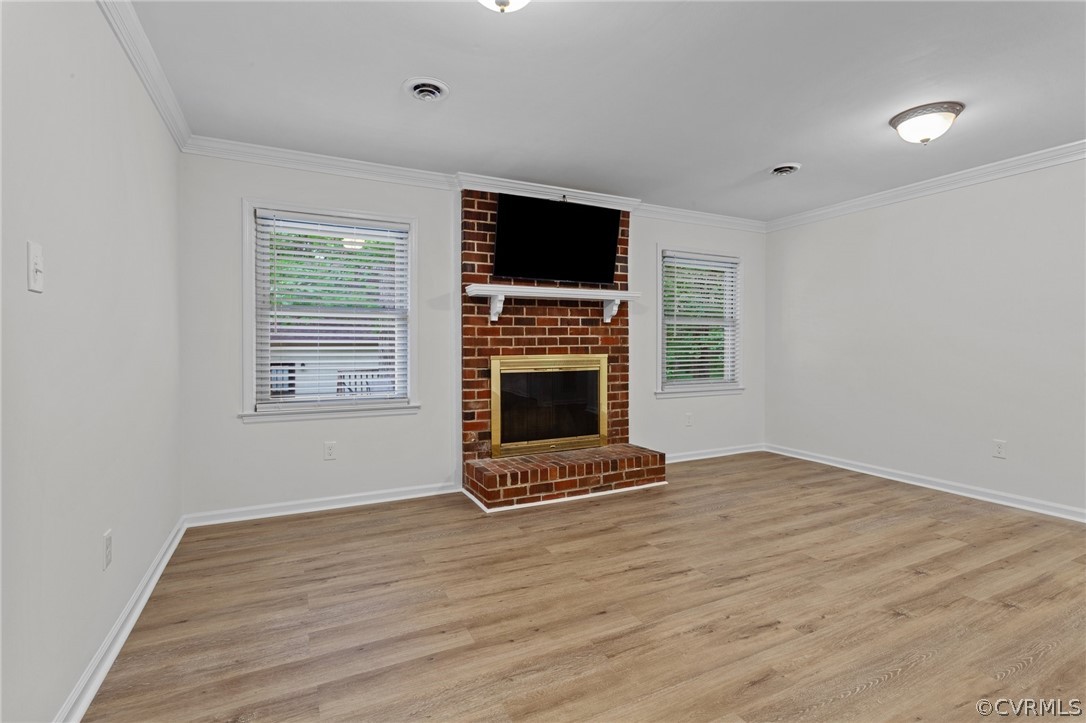 8601 Beaver Bridge Road Moseley, VA 23120 - Photo 10 of 42 a view of an empty room with a fireplace and a window